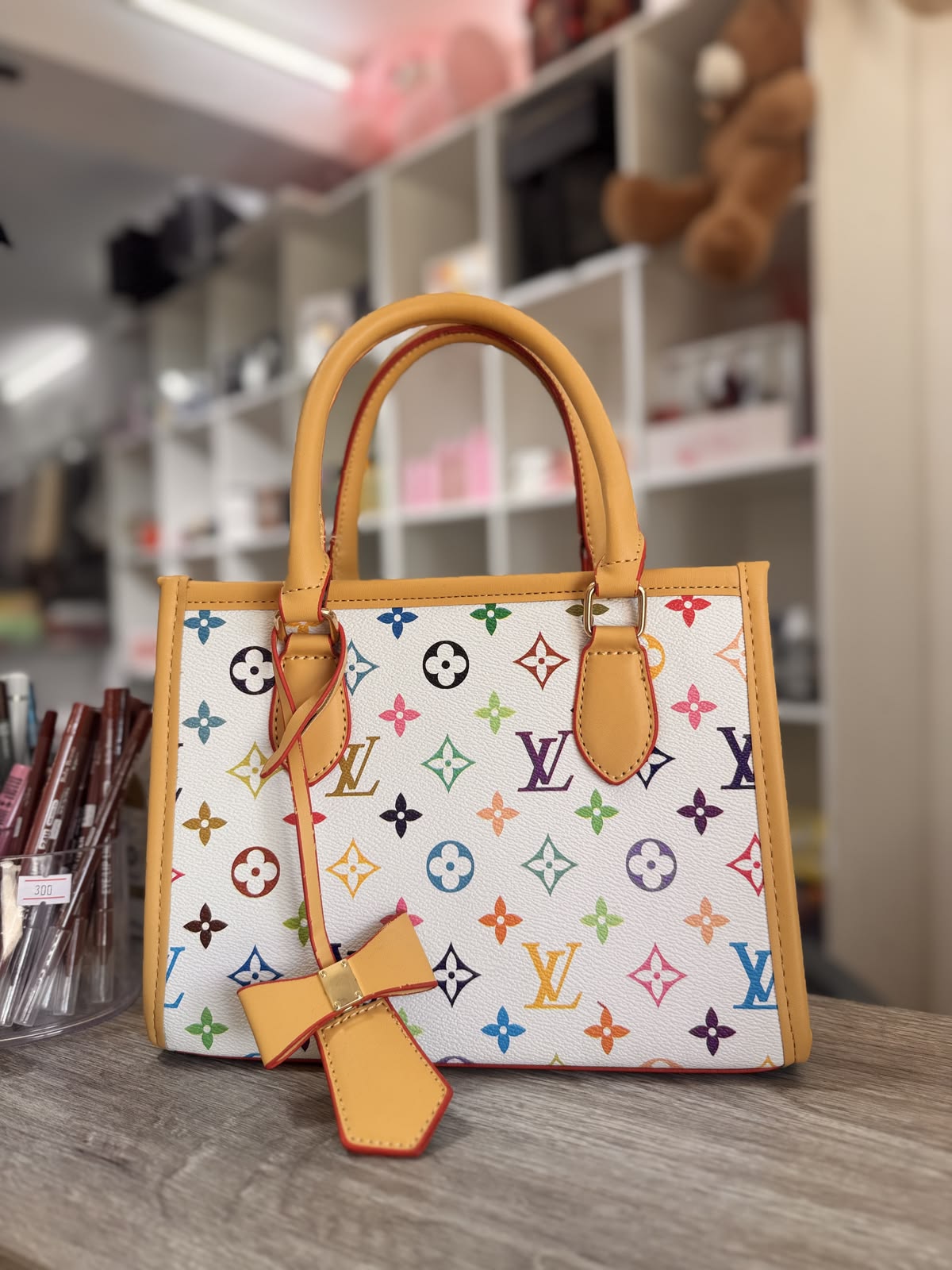LV Classic Monogram Women's Handbag with Black Trim & Chic Bow Charm