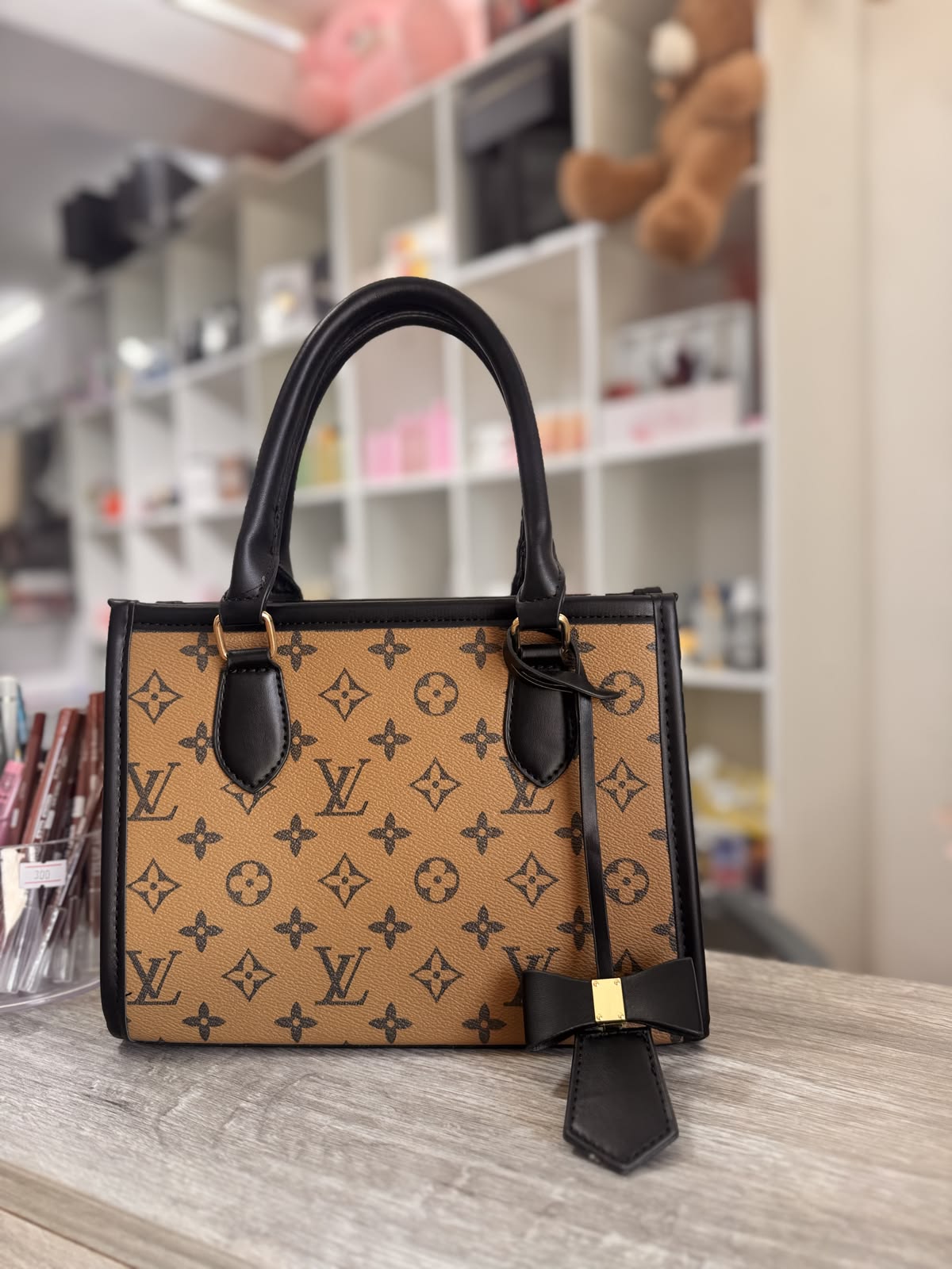 LV Classic Monogram Women's Handbag with Black Trim & Chic Bow Charm